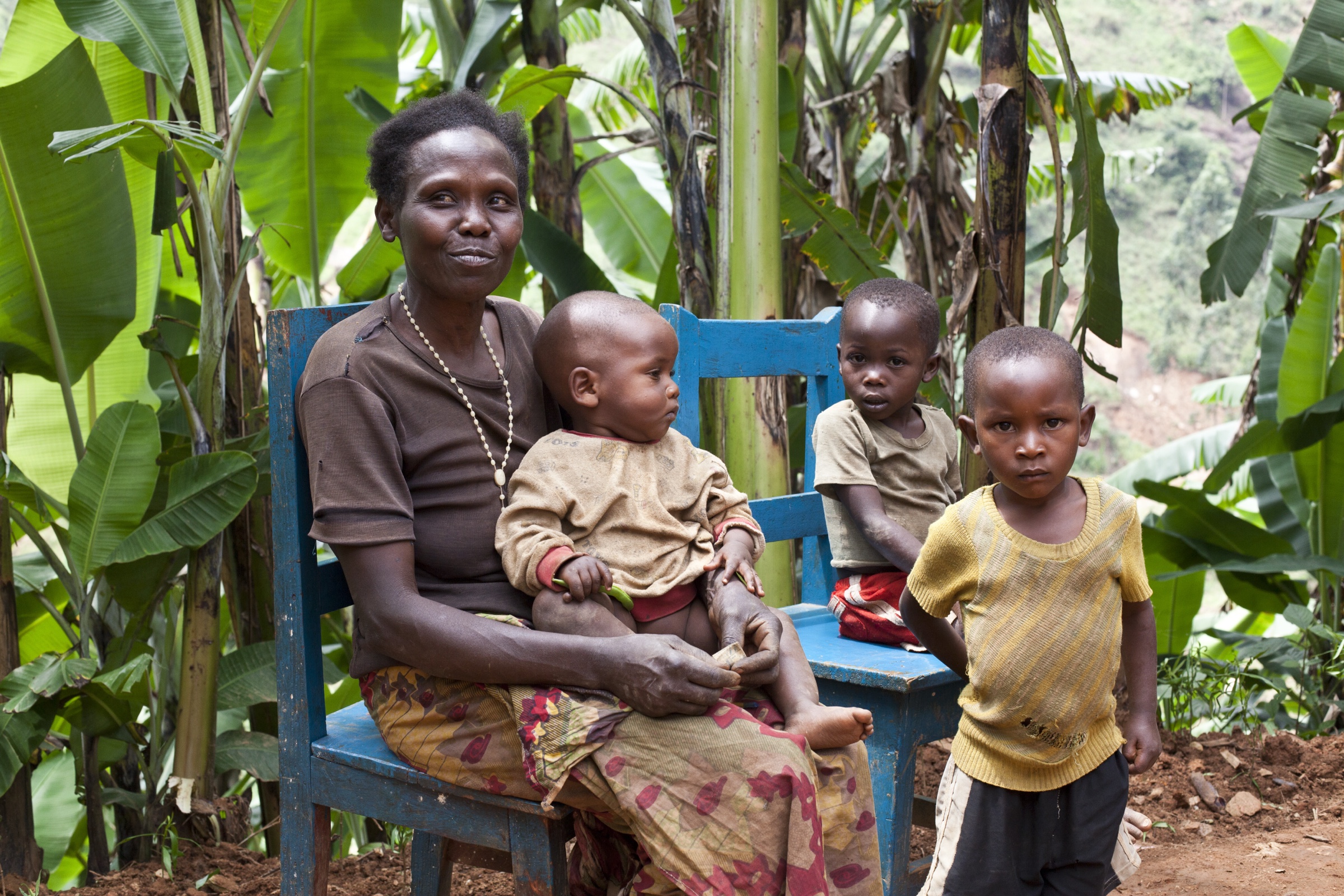 A grandmother and young children in a rural community — the people Kuumba Code serves