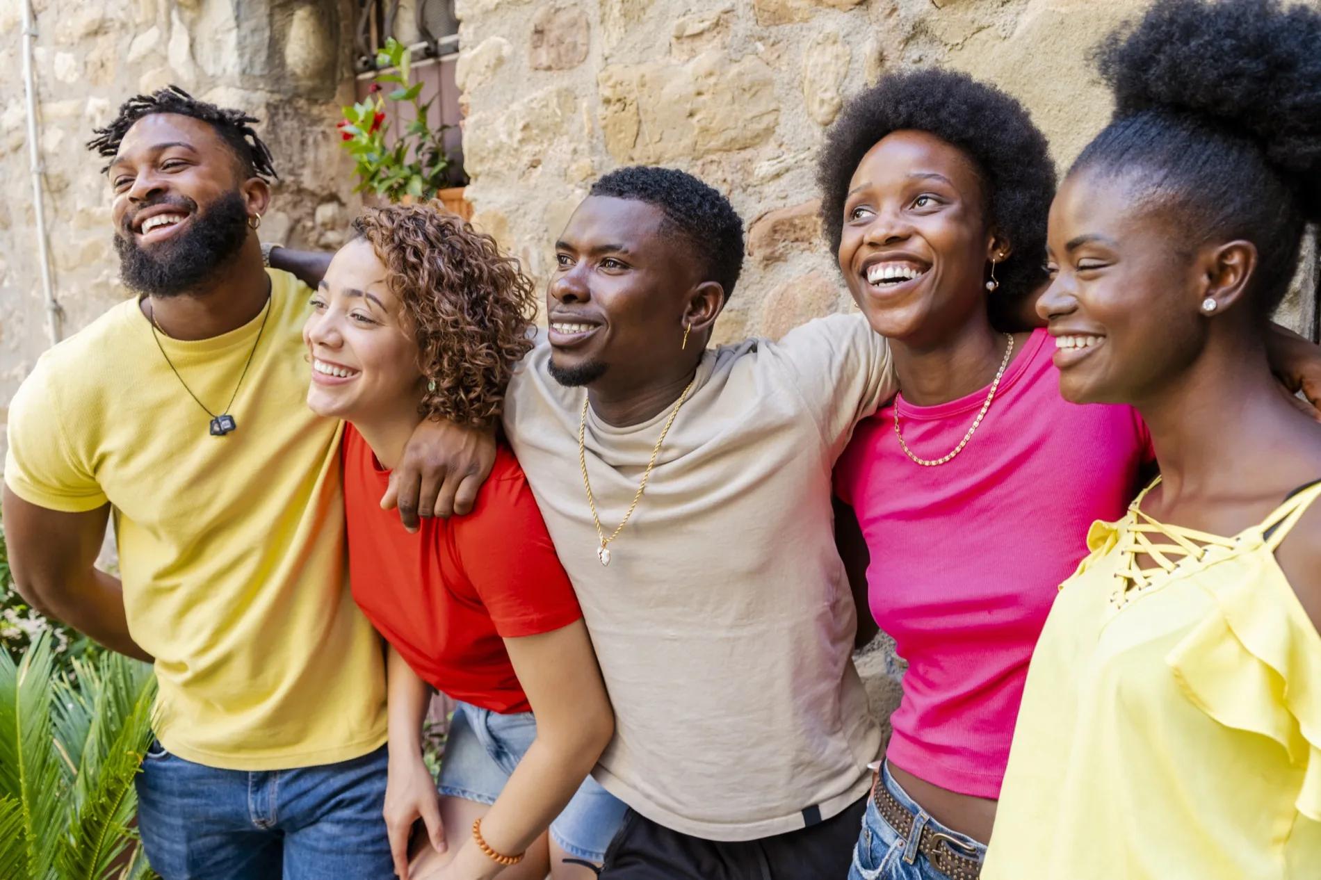 A group of young people together, smiling